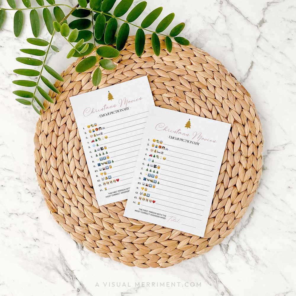 2 christmas movies emoji pictionary printed game pages on seagrass mat