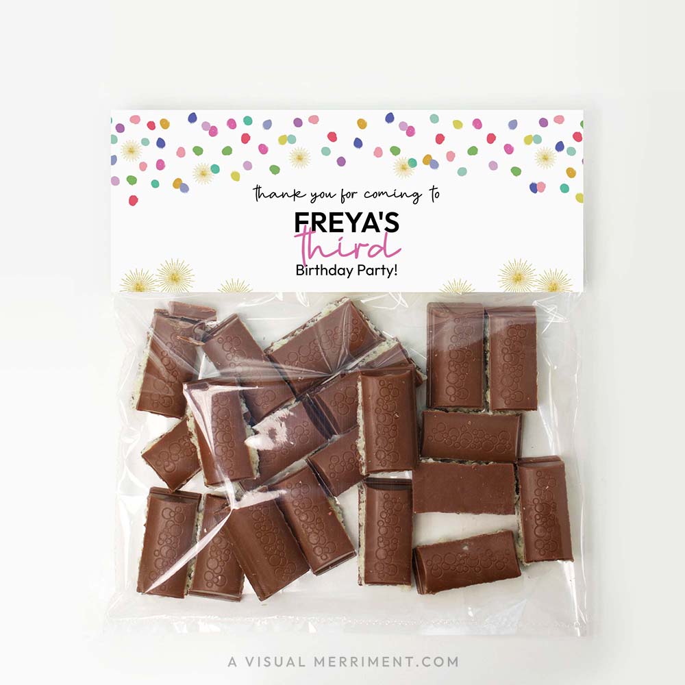 bag of chocolate treats with colorful polka dot rainbow confetti printable bag topper template