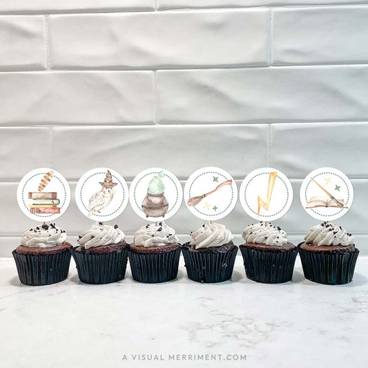 Cupcakes with printable wizard party toppers inspired by Harry Potter, featuring magical icons like owls, potions, and lightning bolts