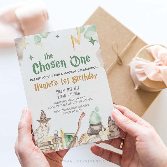 hands holding chosen one wizard school invitation in a harry potter theme with magical elements