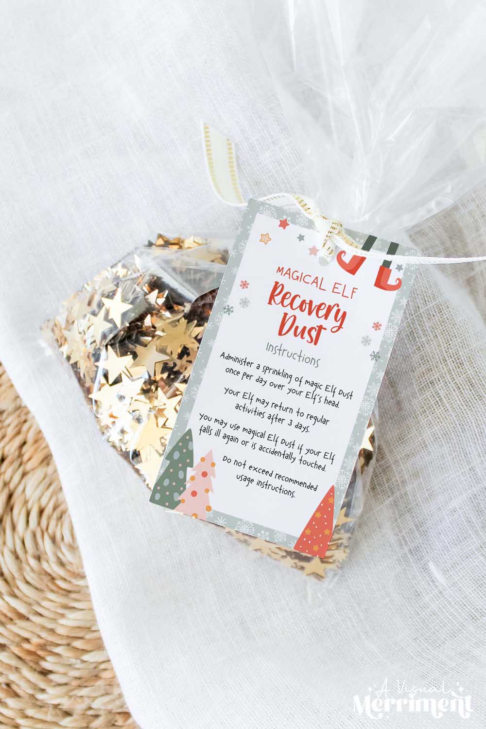 vertical elf on the shelf touched magic dust gift tag tied to bag of glitter sparkles