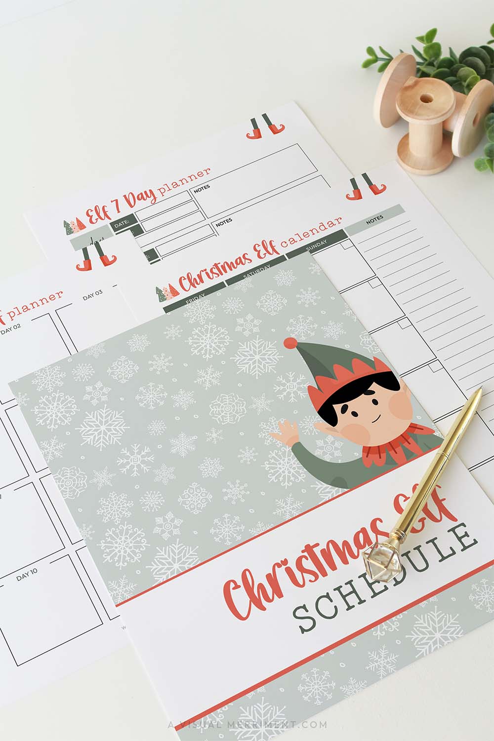 Vertical green christmas elf planner schedule pages laid out with gold pen