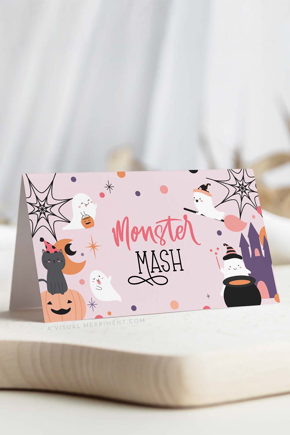 vertical of pink halloween food place card with ghost and celestial design, includes 'monster mash' text