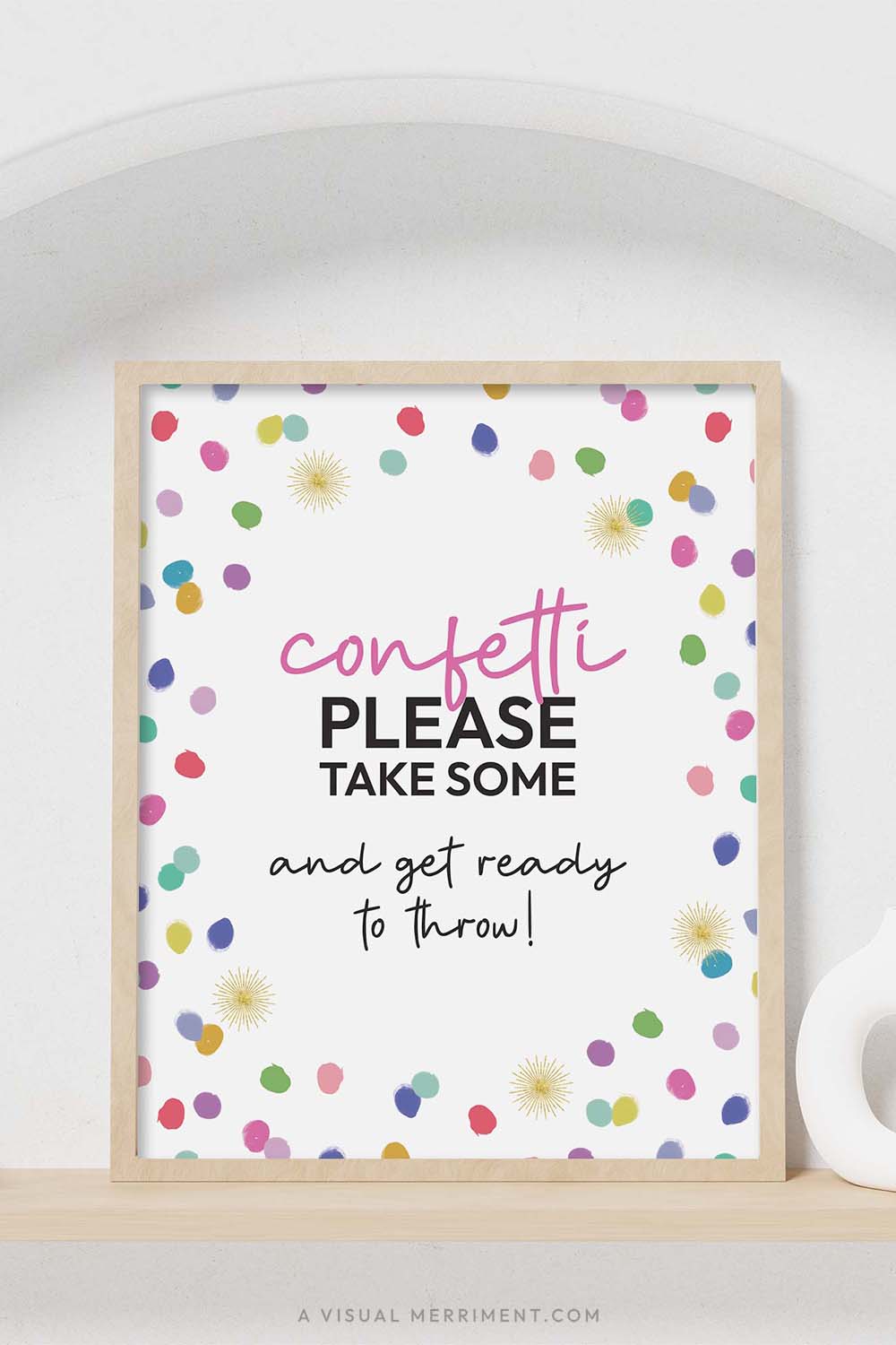 colorful rainbow confetti polka dots ‘please take confetti’ party sign in a frame sitting on a shelf