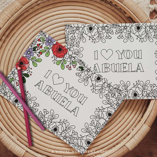 Half colored I love you Abuela grandparents day coloring card with pencils on table