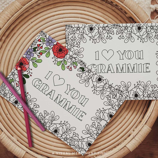 Half colored I love you Grammie grandparents day coloring card with pencils on table