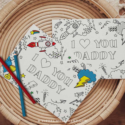 Half colored I love you daddy printable fathers day coloring card with pencils on table