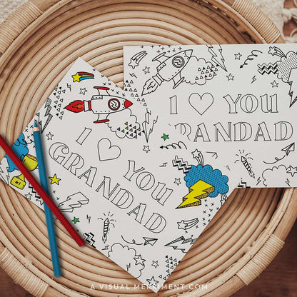Half colored I love you grandad grandparents day coloring card with pencils on table