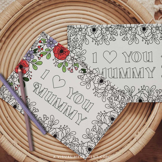 Half colored I love you Mummy mother’s day coloring card with pencils on table
