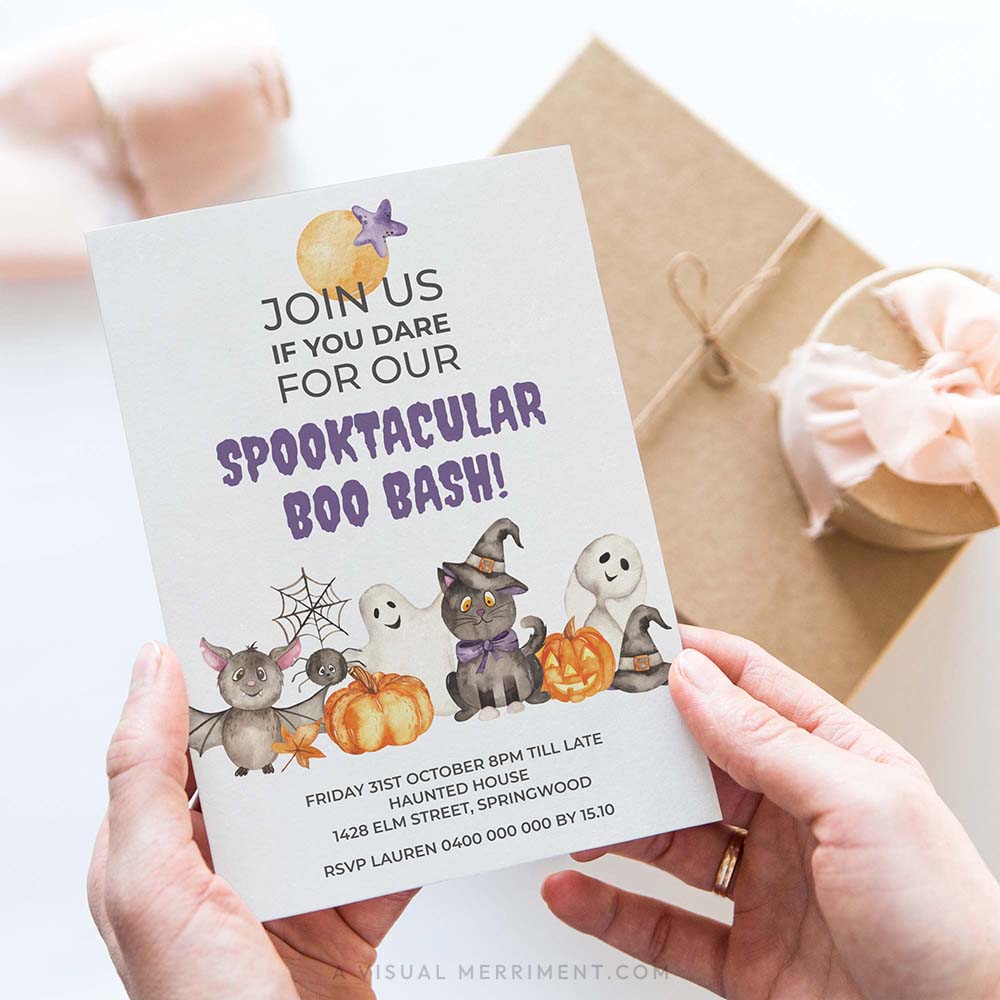 hands holding spooktacular boo bash halloween invitation with cute watercolor characters