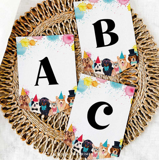 set of 3 letter banner flags with paint splatter dogs in party hats design on grass mat