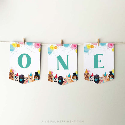 printable ONE banner flags with party dogs and paint splatters, hanging with pegs