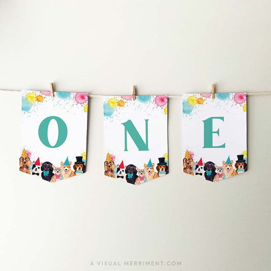 printable ONE banner flags with party dogs and paint splatters, hanging with pegs
