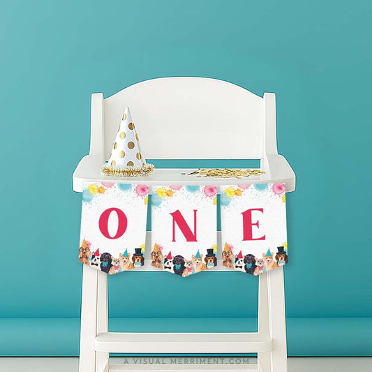 White high chair with a red 'ONE' printable dog party banner and party hat