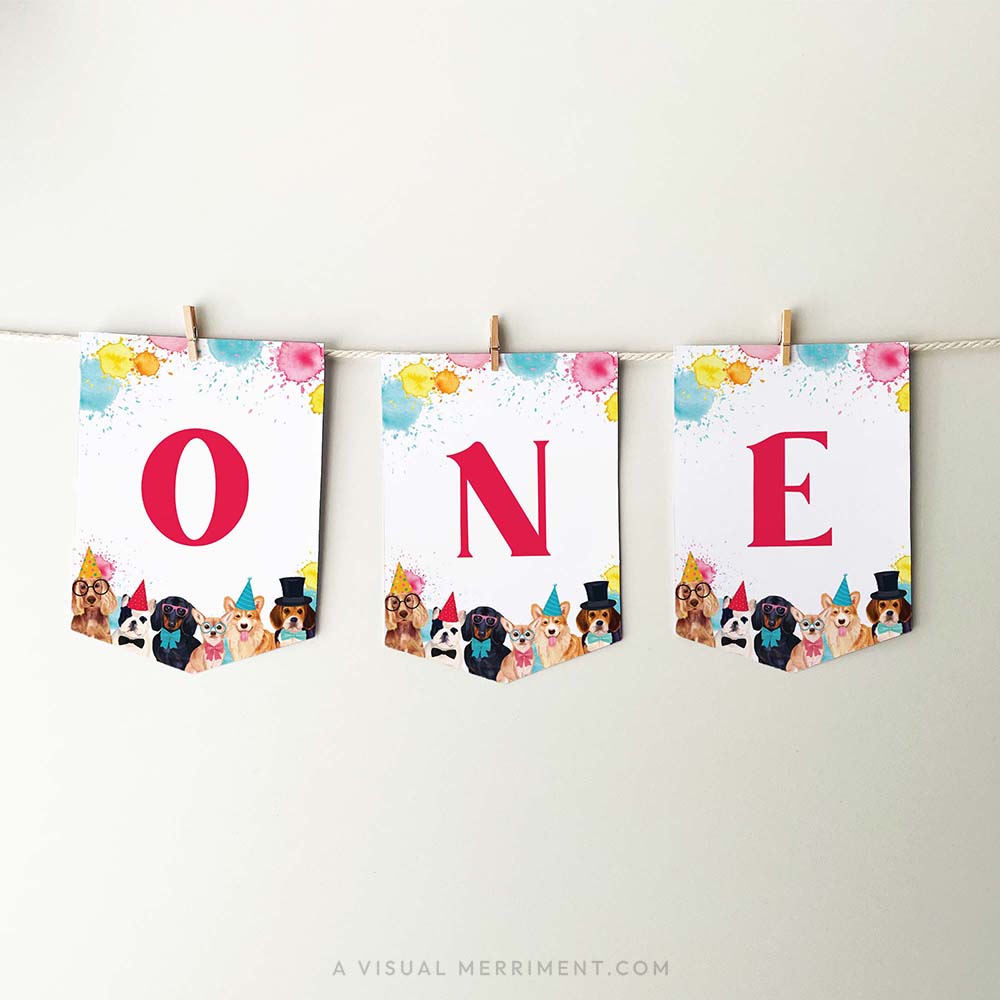 printable red ONE banner flags with party dogs and paint splatters, hanging with pegs