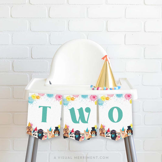 high chair with green pawty dogs printed TWO banner flags, party hat against brick wall