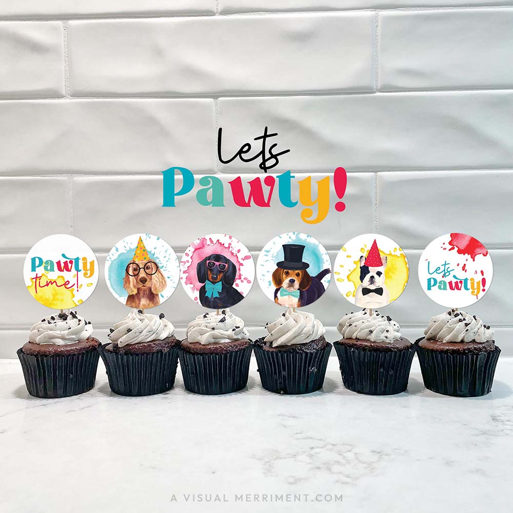 Cupcakes with party dog printable cupcake toppers lined against tiled wall