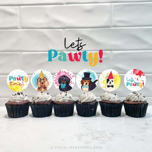 Cupcakes with party dog printable cupcake toppers lined against tiled wall