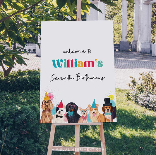 Large custom welcome sign with party dogs wearing party hats on an easel outdoors.