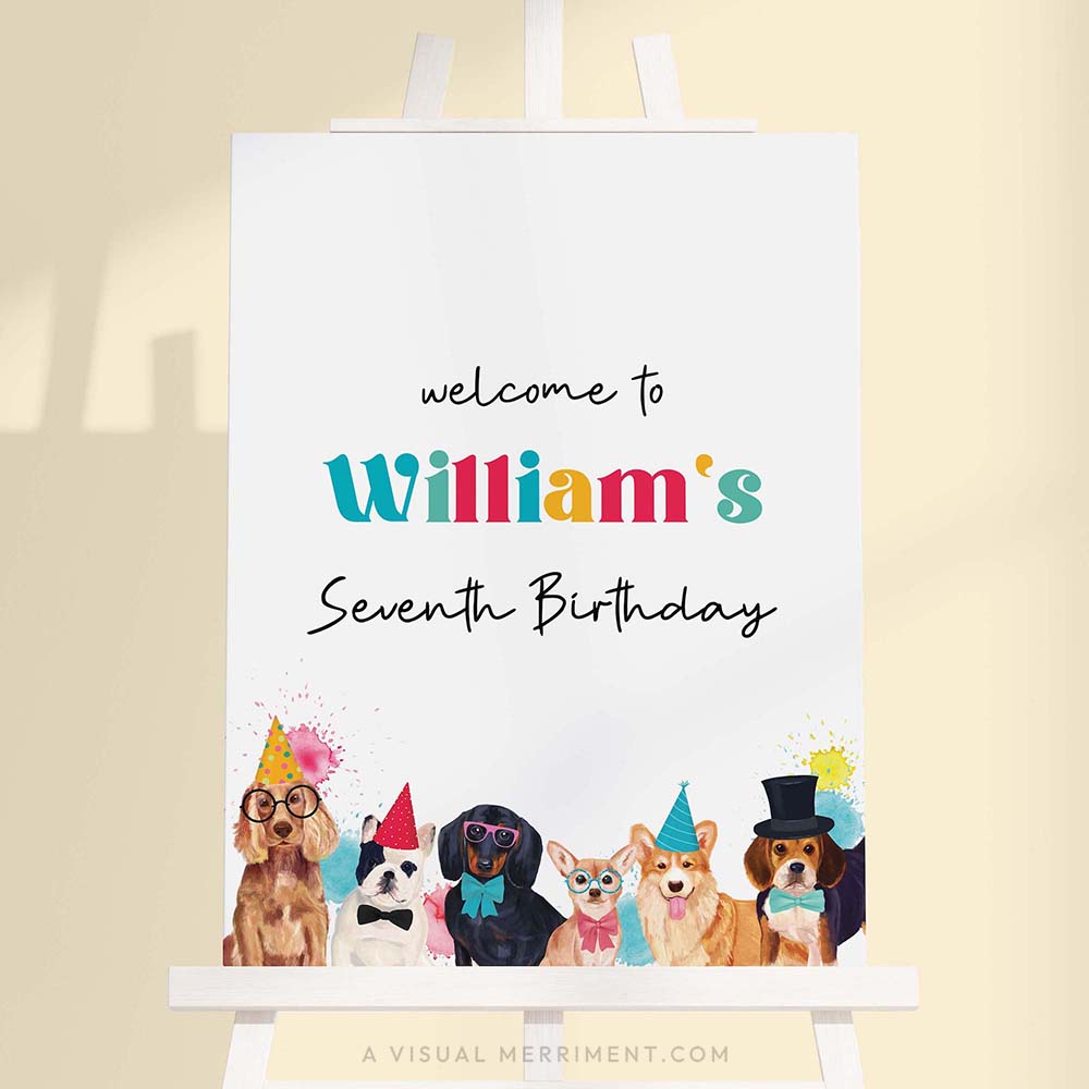 Large colorful welcome birthday sign with party dogs wearing party hats on a white easel