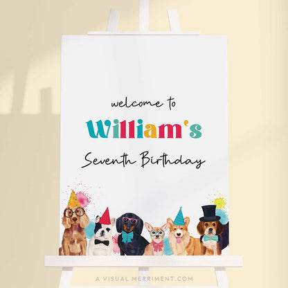 Large colorful welcome birthday sign with party dogs wearing party hats on a white easel