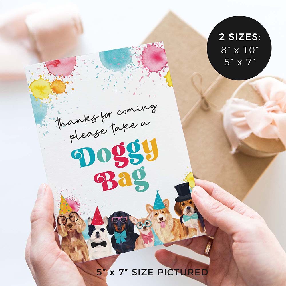 hands holding please take a doggy bag party favor party sign with party dogs and gifts in background