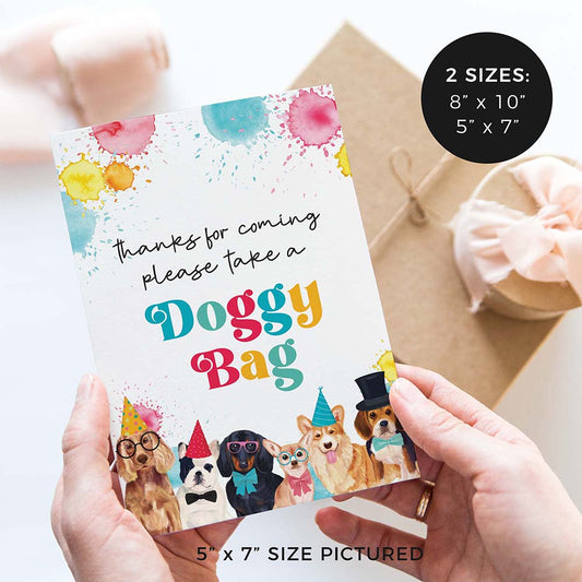 hands holding please take a doggy bag party favor party sign with party dogs and gifts in background