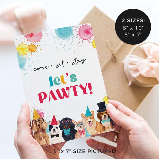 hands holding come, sit, stay - let’s pawty party sign with party dogs and gifts in background