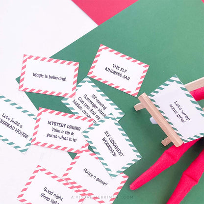 printed activity & kindness elf on the shelf props signs on easel next to elf doll