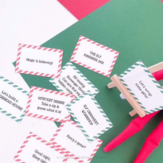 printed activity & kindness elf on the shelf props signs on easel next to elf doll