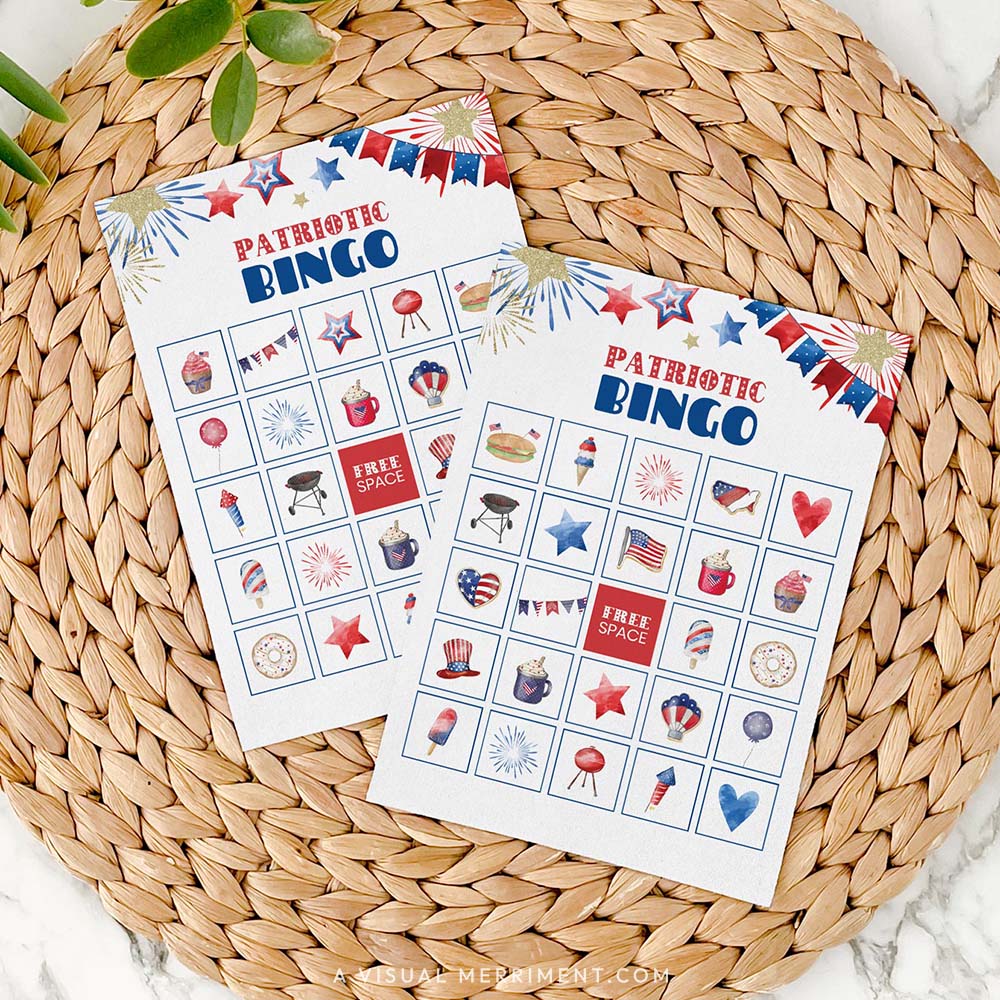 2 patriotic bingo game cards on mat with marble background