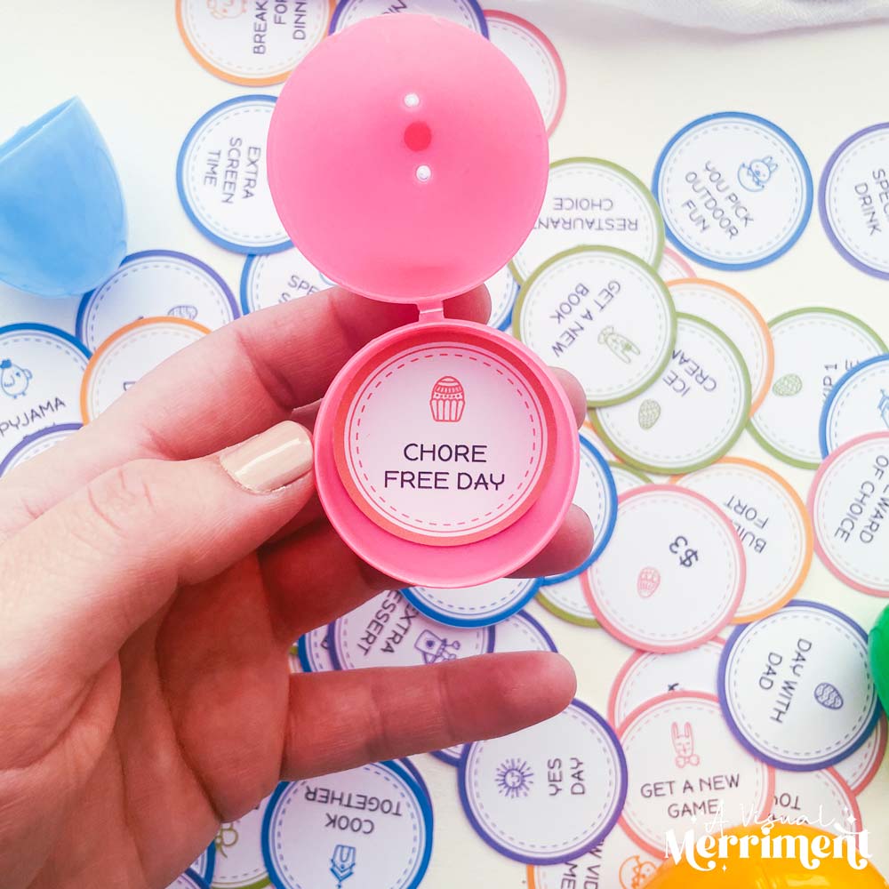hand holding printable easter egg token for chore free day in reusable easter egg