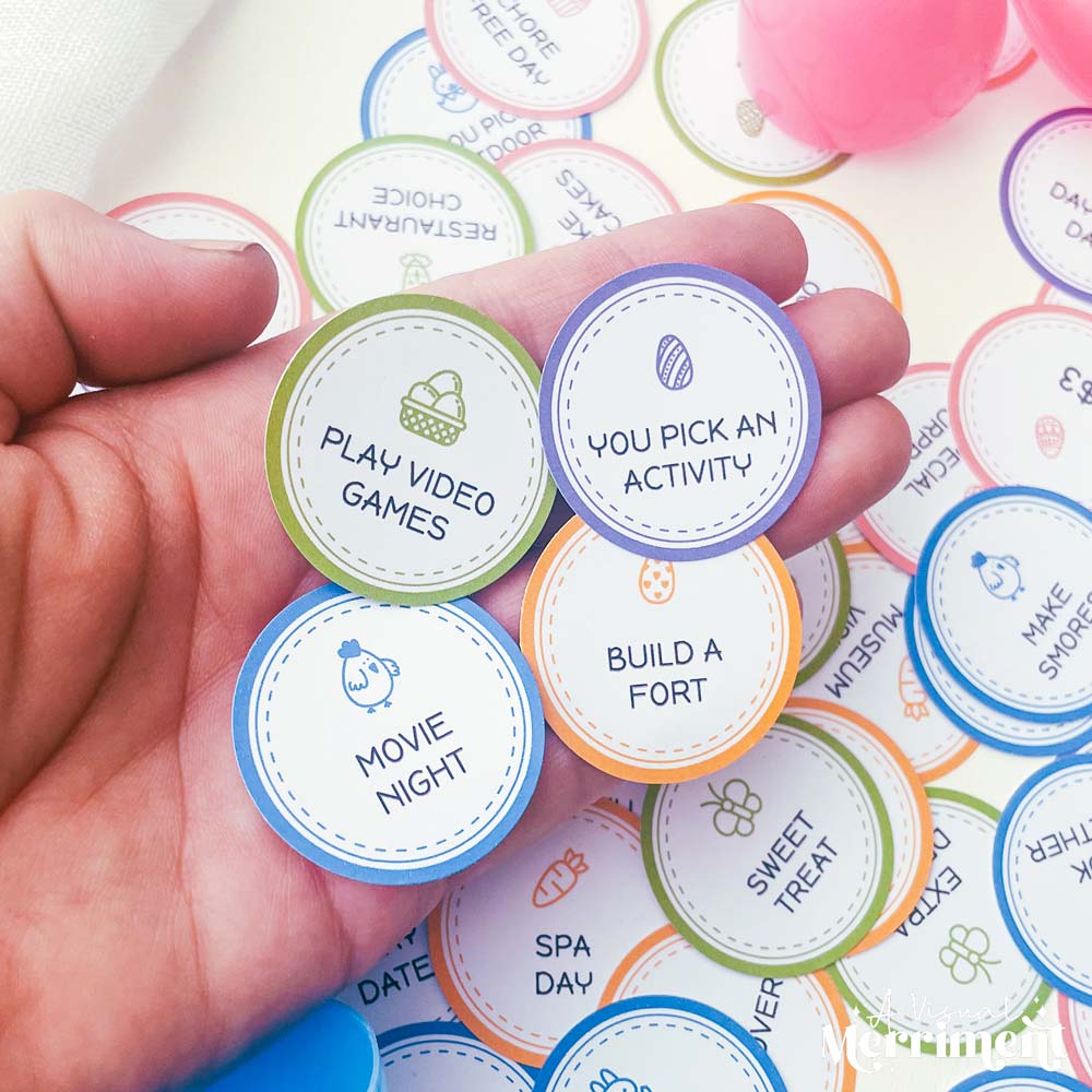 hand holding several non candy rewards on easter egg tokens