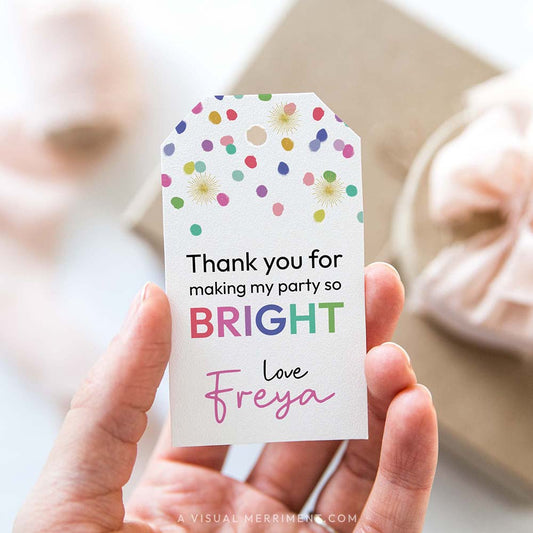 Hand holding rainbow confetti editable gift tag template with polka dots and thank you text