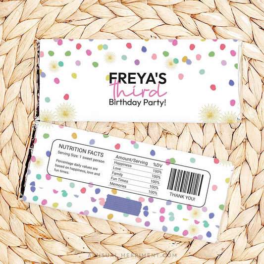 front and back of colorful polka dot rainbow confetti chocolate bars on woven mat