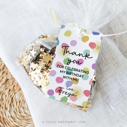 Bag of gold sequins on a mat with a colorful rainbow confetti editable gift tag template