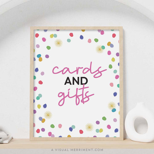colorful rainbow confetti polka dots ‘cards and gifts’ party sign in a frame sitting on a shelf