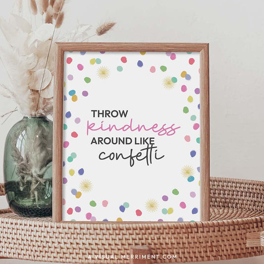 throw kindness around like confetti rainbow polka dot printable party sign in a frame sitting on a grass table