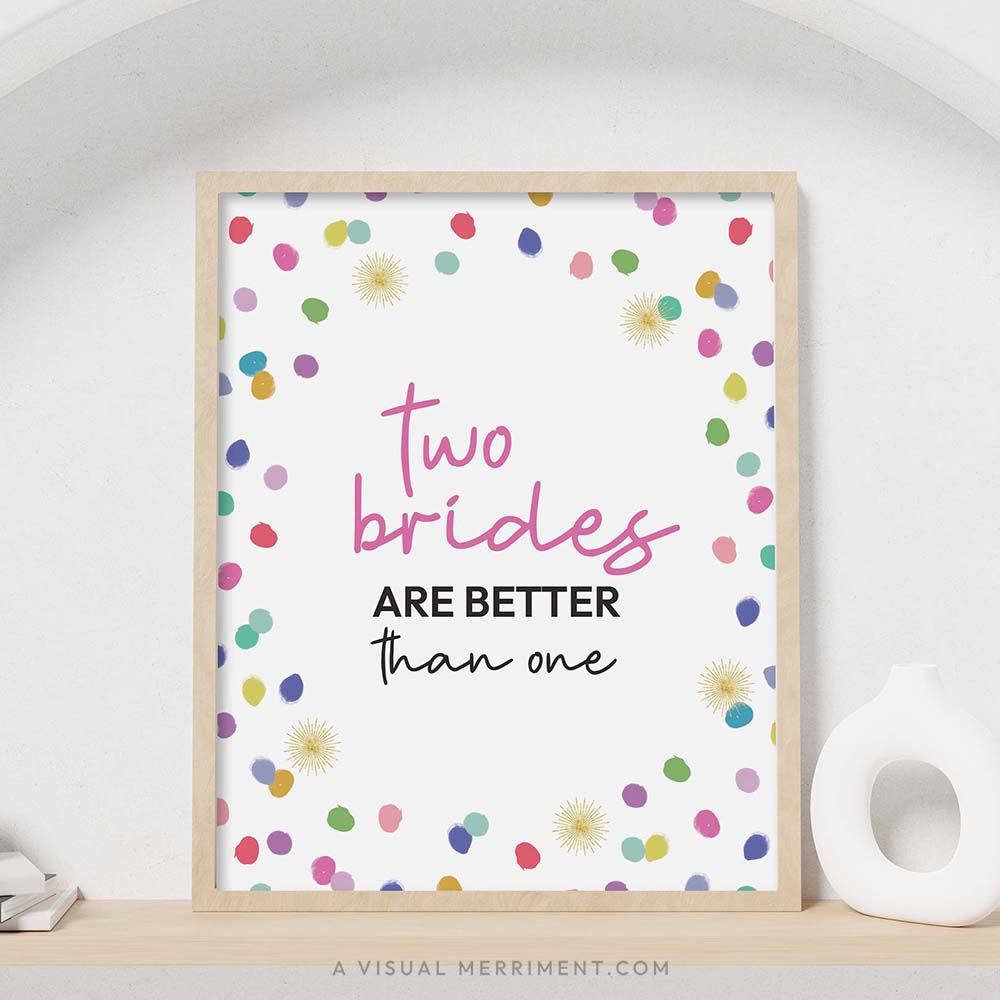 colorful rainbow confetti polka dots ‘two brides better than one’ party sign in a frame sitting on a shelf