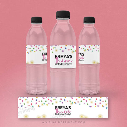 three water bottles with labels and a laid out custom water bottle label with colorful polka dot rainbow confetti