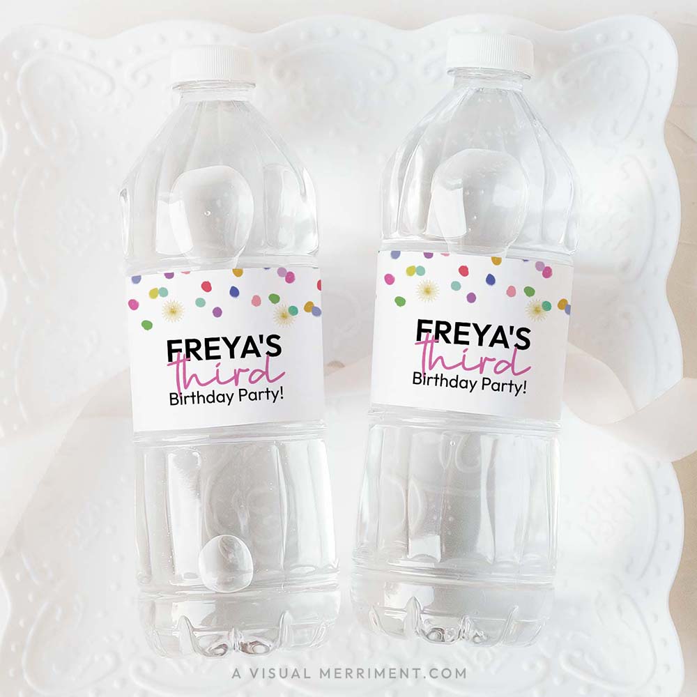 2 bottles with colorful polka dot rainbow confetti custom water bottle labels on white plate