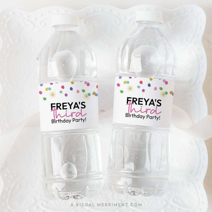 2 bottles with colorful polka dot rainbow confetti custom water bottle labels on white plate