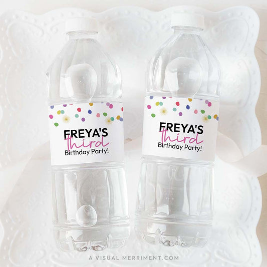 2 bottles with colorful polka dot rainbow confetti custom water bottle labels on white plate
