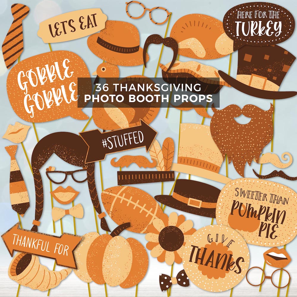 set of thanksgiving photo booth props attached to sticks on blue background