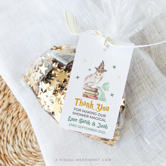 Harry potter style thank you baby shower gift tag template with wizard school elements attached to bag of sequins