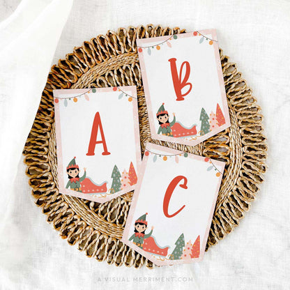 Printed ABC pink elf on the shelf banner sign laying on mat