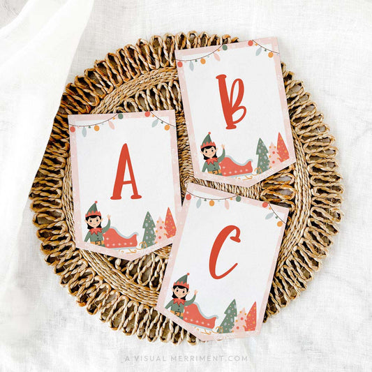 Printed ABC pink elf on the shelf banner sign laying on mat