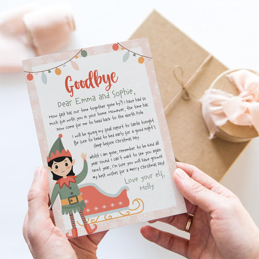 hands holding girl's pink goodbye letter from elf on the shelf