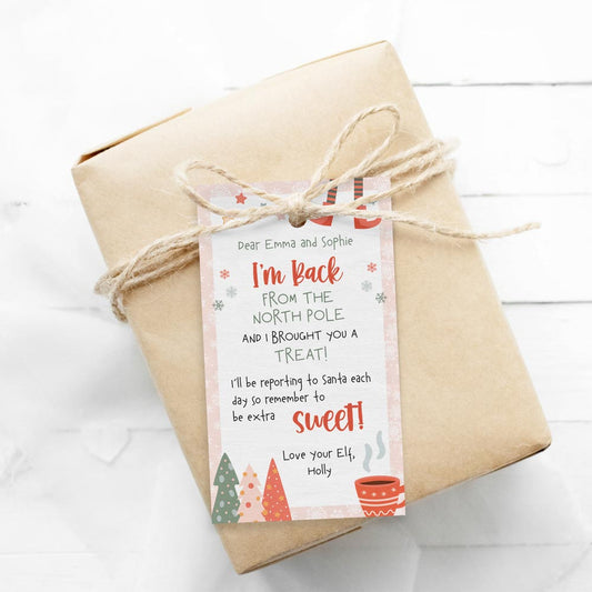 printed pink elf on the shelf i’m back gift tag on wrapped gift