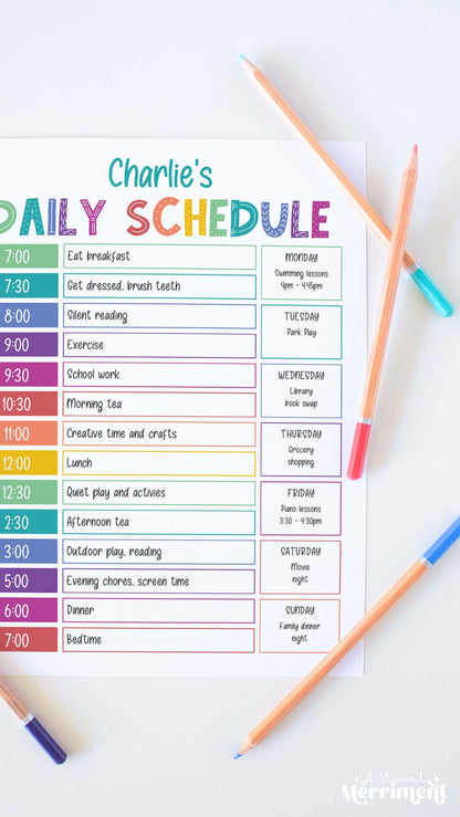 Vertical of editable printable kids rainbow daily schedule with pencils